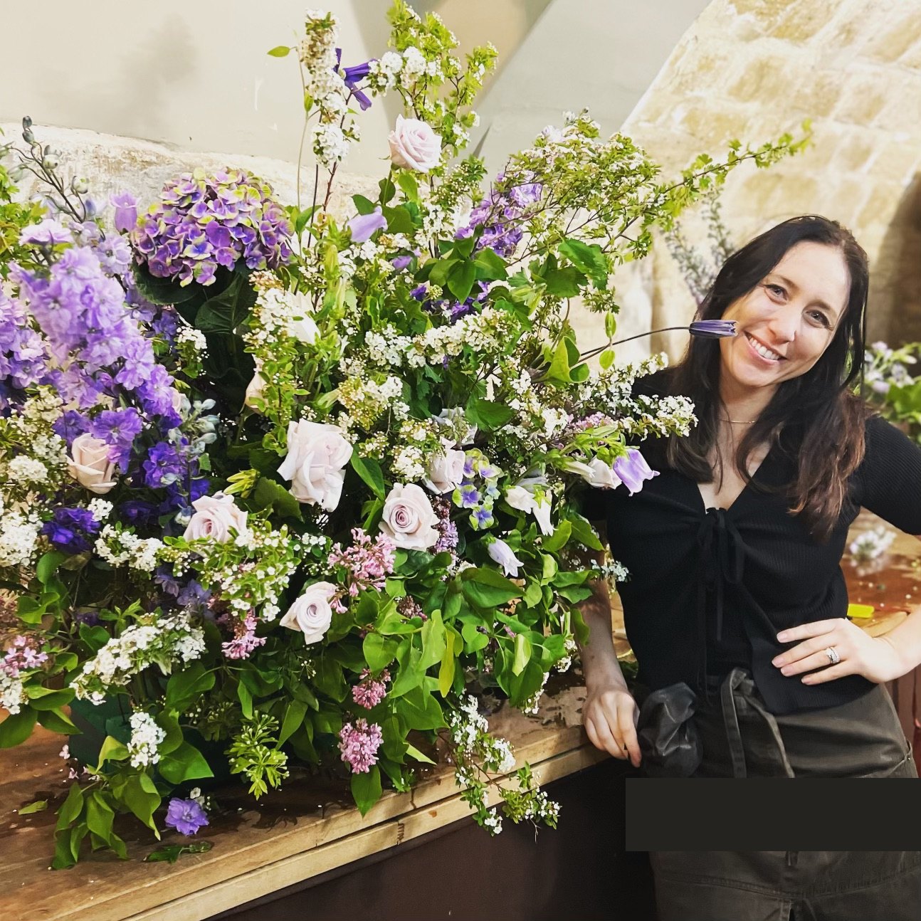 Brittany of Golden Flowers with a large floral installation
